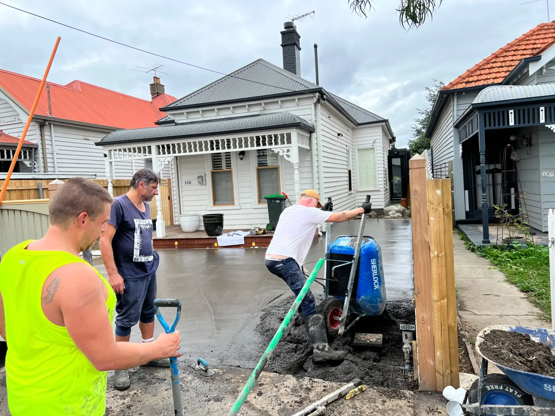 Driveway concrete pour in progress at a heritage home in Brunswick