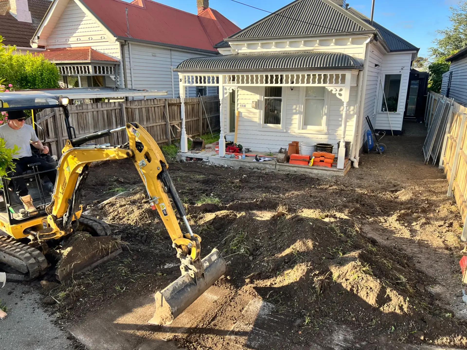 Excavation and site preparation underway in a residential front yard in Brunswick.