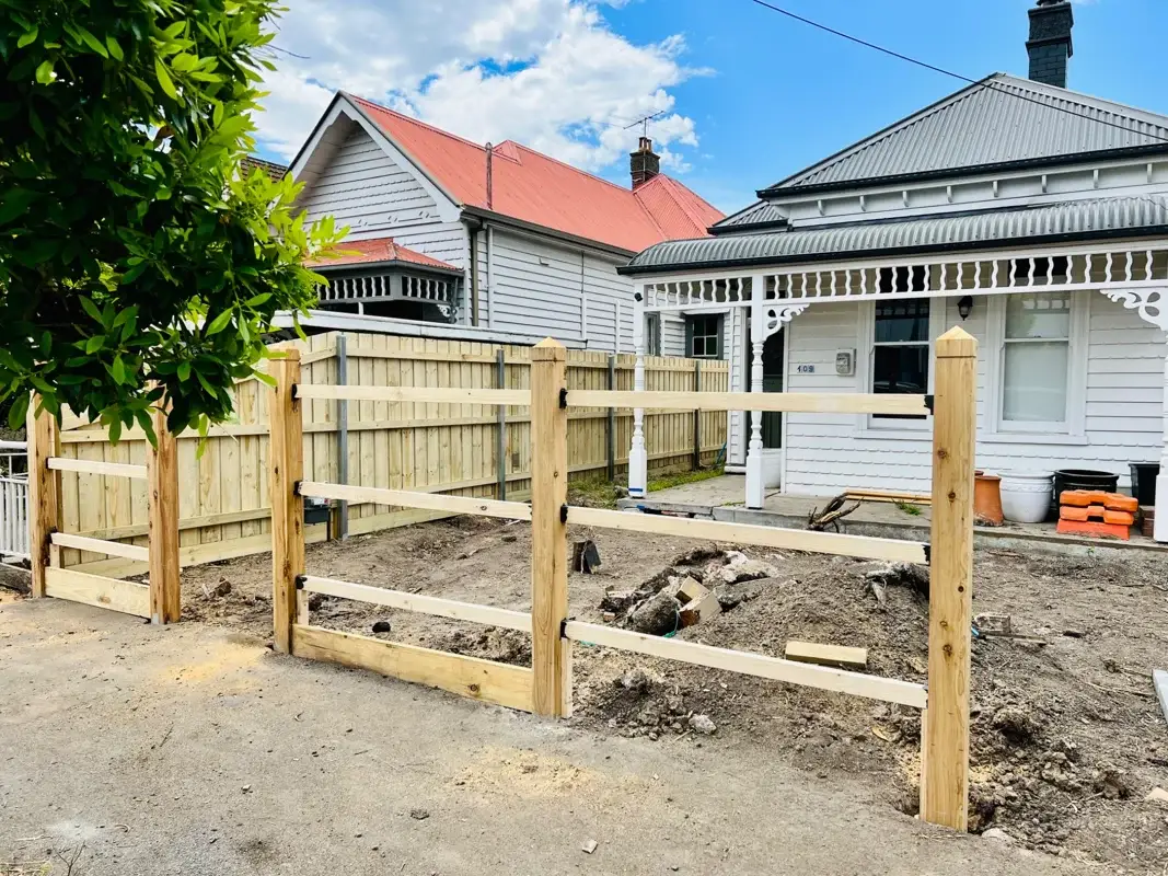 New timber fence installation during front yard landscape upgrade